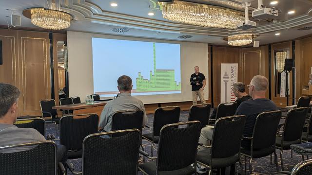 Dmitry Chuyko showing a slide with a flame graph of a native image application
